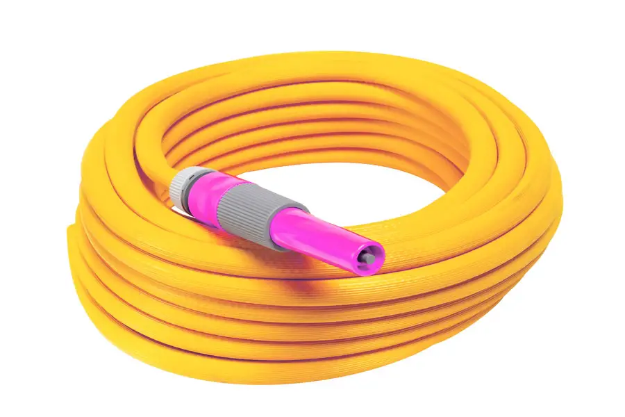 a coiled orange rubber hose
