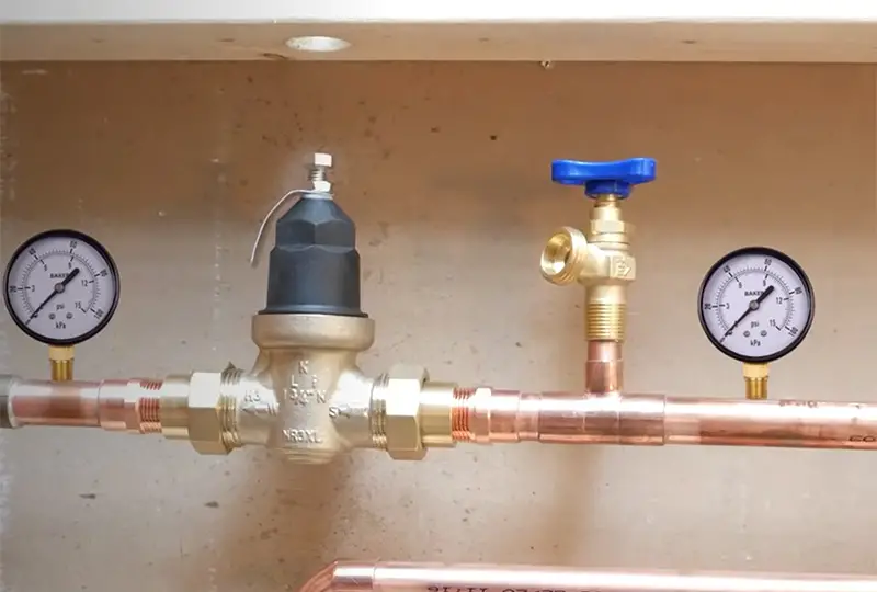 a pipe with two water pressure valves