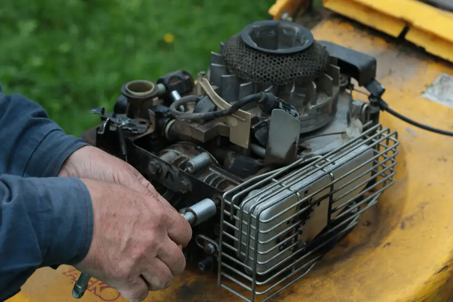 a lawn mower engine undergoing maintenance