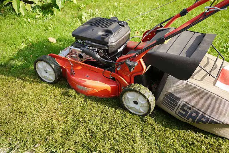 lawn mower on green lawn