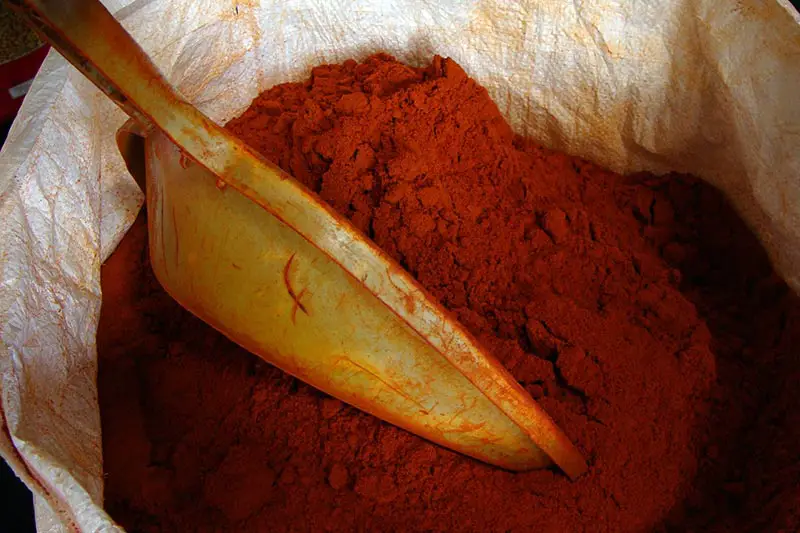 a sack of cayenne pepper with a scoop