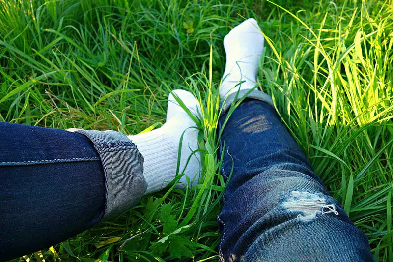 feet on a grassy lawn
